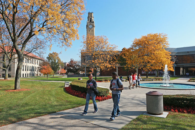 Students walking by the fountain