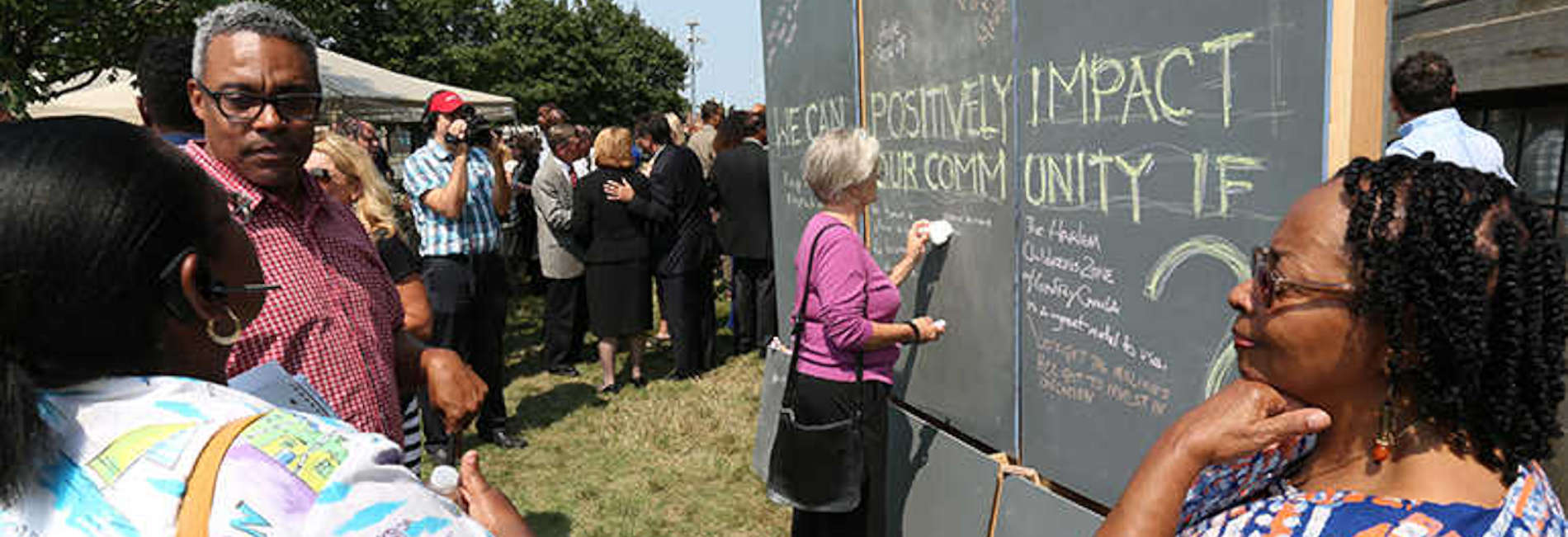 Community improvement event with outdoor chalkboards for ideas.
